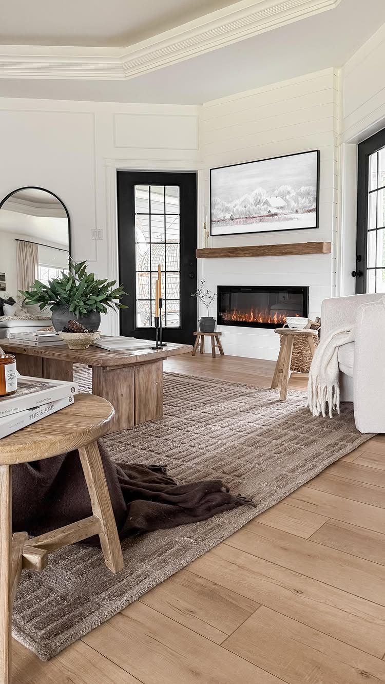 15 Living Room Natural Design Ideas with Organic Style 15 Bright living room with neutral tones, wooden furniture, and a textured brown rug.