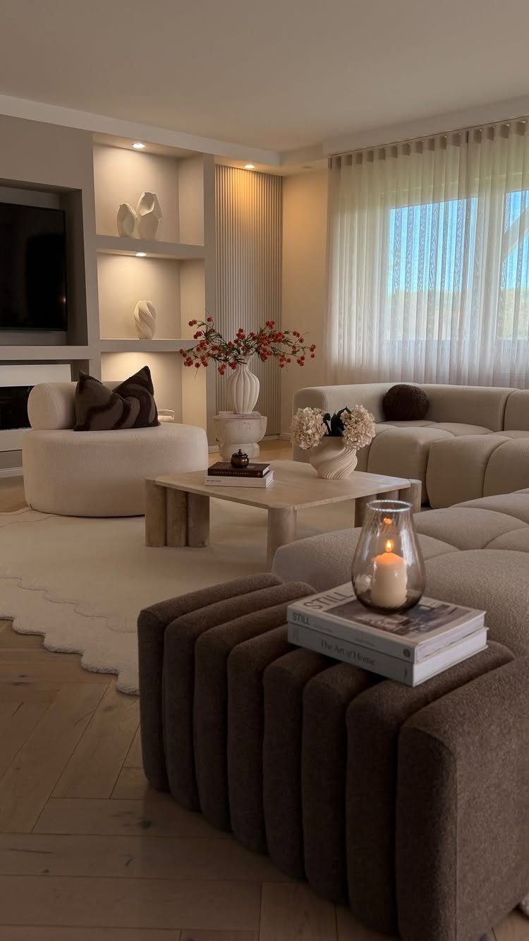 15 Living Room Natural Design Ideas with Organic Style 3 Modern living room with neutral beige and brown furniture and a stone coffee table.